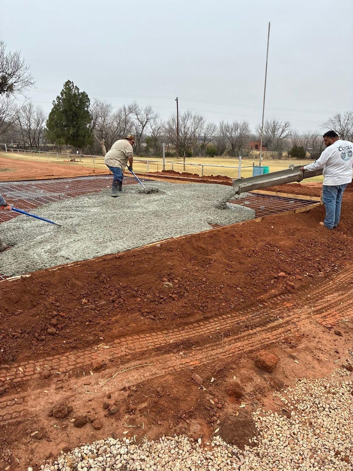 Screeding and finishing concrete on a new pad